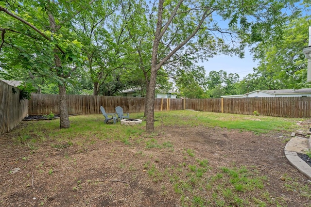 1607 Forest St, Georgetown, TX 78626 - fenced backyard with a fire pit