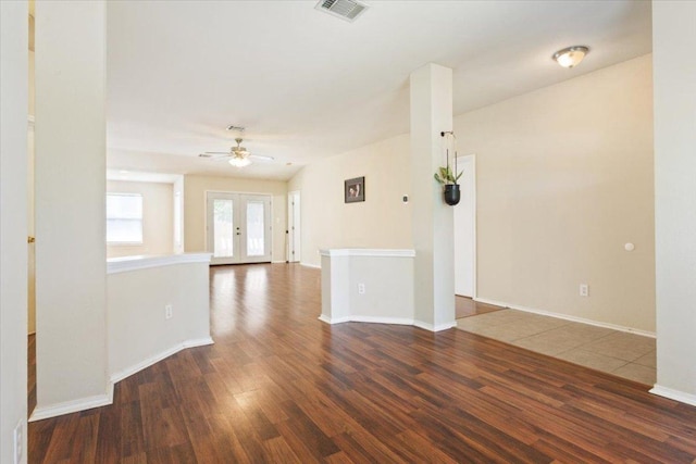 3005 Sugar Berry Cv, Round Rock, TX 78664 - empty room with wood finished floors, a ceiling fan, baseboards, and french doors