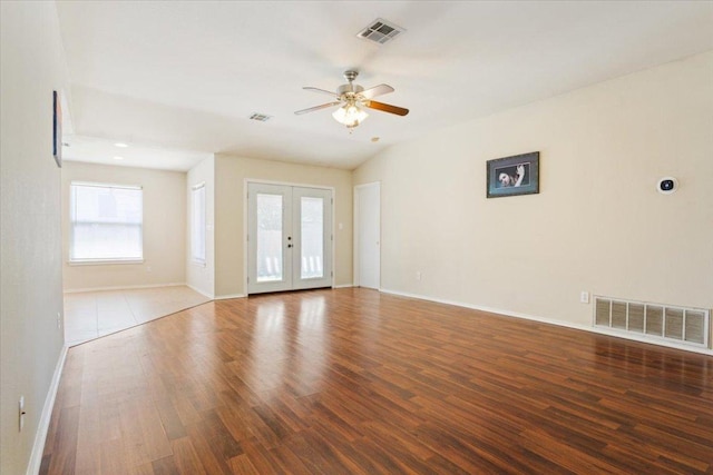 3005 Sugar Berry Cv, Round Rock, TX 78664 - spare room featuring wood finished floors, a ceiling fan, baseboards, and french doors