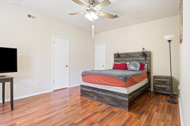 3005 Sugar Berry Cv, Round Rock, TX 78664 - bedroom with wood finished floors, ceiling fan, and baseboards