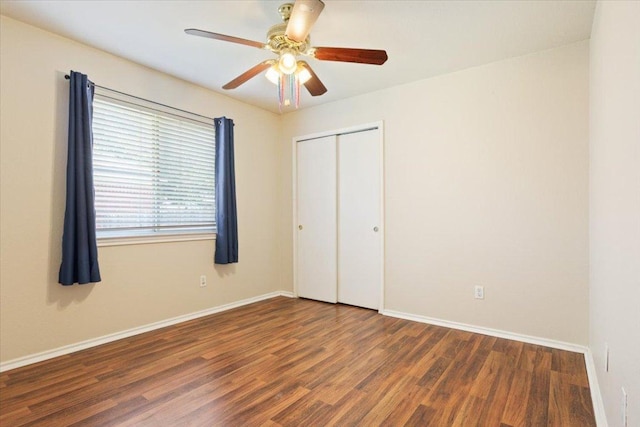 3005 Sugar Berry Cv, Round Rock, TX 78664 - unfurnished bedroom featuring wood finished floors, baseboards, and a closet