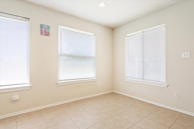 3005 Sugar Berry Cv, Round Rock, TX 78664 - spare room with light tile patterned flooring, baseboards, and recessed lighting