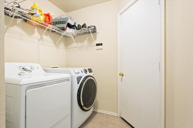 3005 Sugar Berry Cv, Round Rock, TX 78664 - laundry room with washer and clothes dryer, baseboards, and light carpet