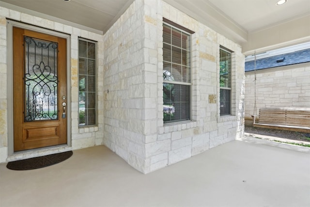 12109 Bryony Dr, Austin, TX 78739 - doorway to property featuring covered porch