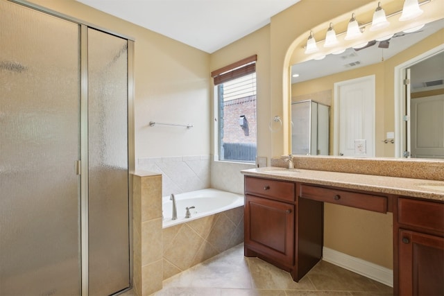 12109 Bryony Dr, Austin, TX 78739 - bathroom featuring double vanity, a shower stall, a bath, and tile patterned floors