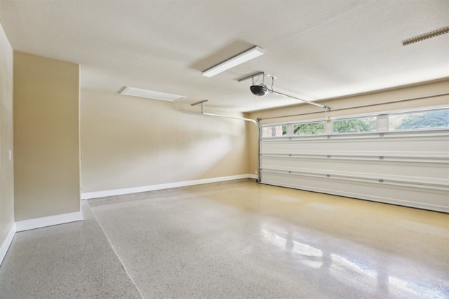 12109 Bryony Dr, Austin, TX 78739 - garage with baseboards and a garage door opener