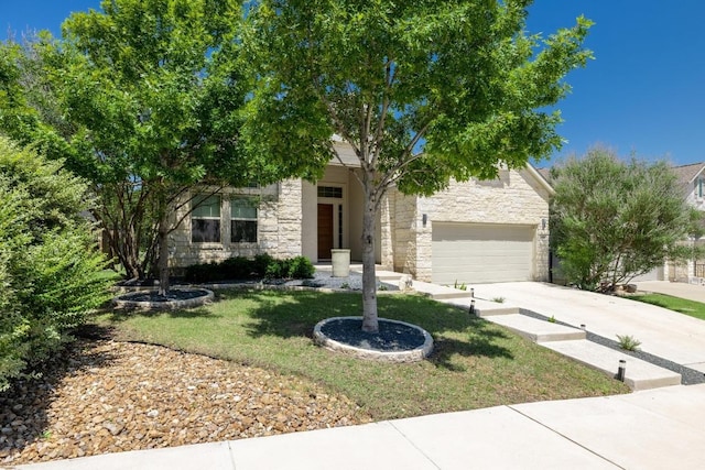 108 Panzano Dr, Georgetown, TX 78628 - view of property hidden behind natural elements with stone siding, driveway, and a front lawn