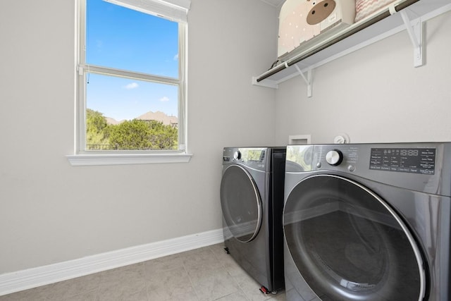 108 Panzano Dr, Georgetown, TX 78628 - laundry room with washing machine and dryer and light tile patterned flooring