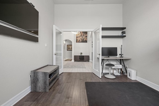 108 Panzano Dr, Georgetown, TX 78628 - corridor with arched walkways and dark wood-style floors