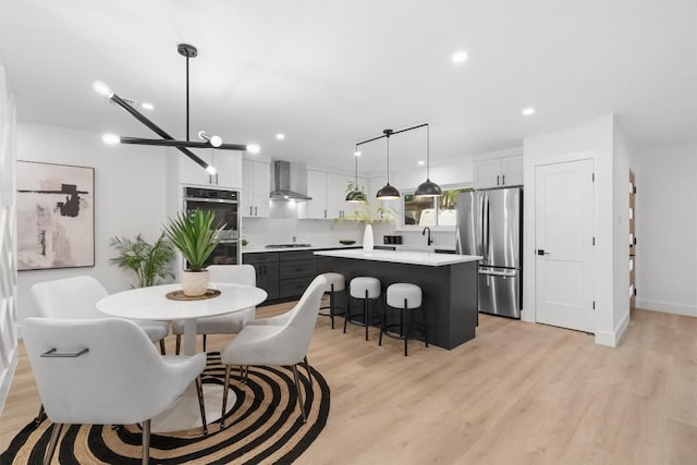 813 Cardiff Dr, Austin, TX 78745 - dining space with light wood-style flooring and recessed lighting