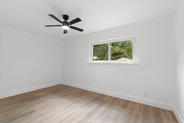 813 Cardiff Dr, Austin, TX 78745 - empty room with light wood finished floors, baseboards, and a ceiling fan