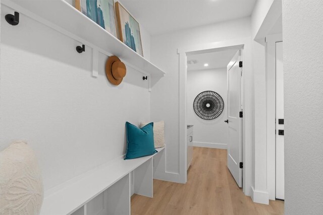813 Cardiff Dr, Austin, TX 78745 - mudroom featuring light wood-style flooring and recessed lighting