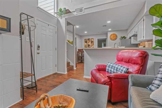 5608 Cougar Dr Unit 226, Austin, TX 78745 - living area with wood finished floors, stairway, and recessed lighting