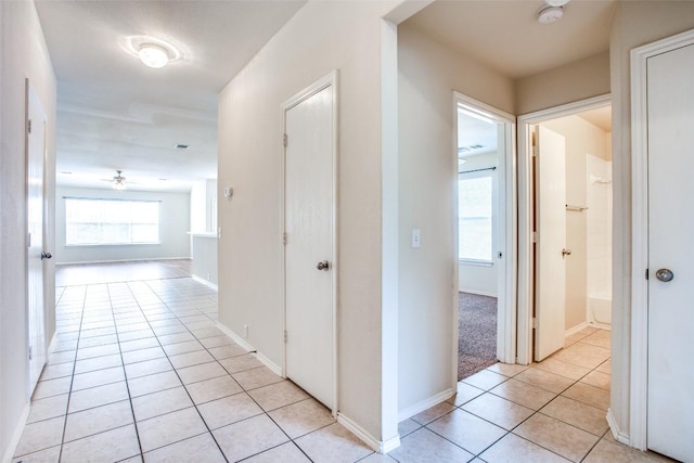 612 Arrowood Pl, Round Rock, TX 78665 - hallway with light tile patterned flooring and baseboards