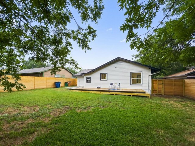 903 Cardiff Dr, Austin, TX 78745 - rear view of house featuring a fenced backyard and a deck