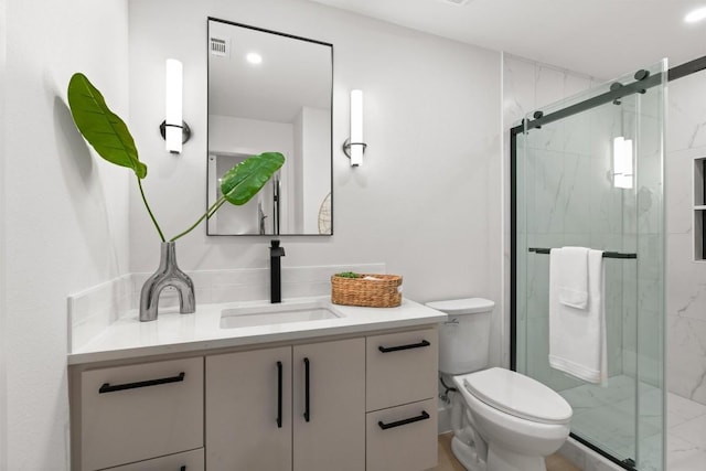 903 Cardiff Dr, Austin, TX 78745 - full bath with vanity, toilet, and a marble finish shower