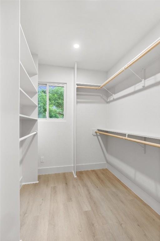 903 Cardiff Dr, Austin, TX 78745 - walk in closet featuring wood finished floors