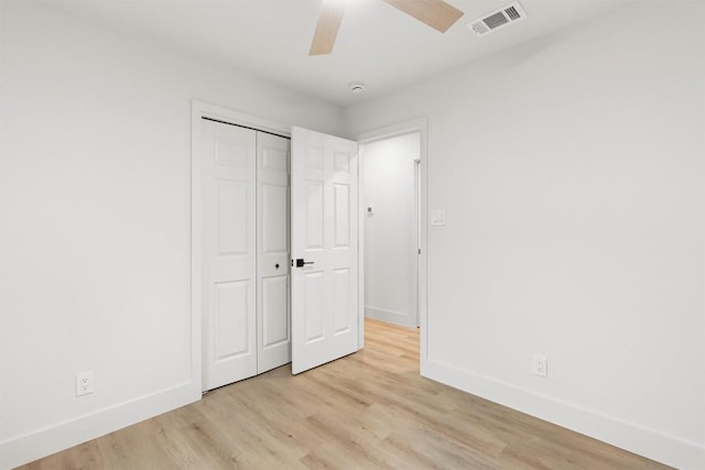 903 Cardiff Dr, Austin, TX 78745 - unfurnished bedroom with light wood-style floors, baseboards, a closet, and a ceiling fan