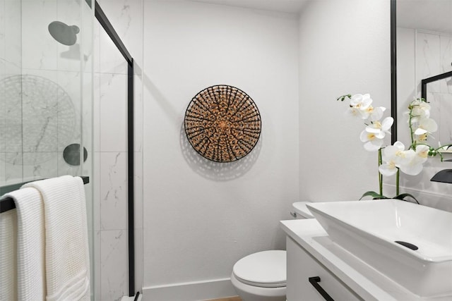 903 Cardiff Dr, Austin, TX 78745 - bathroom with a shower stall, toilet, vanity, and baseboards