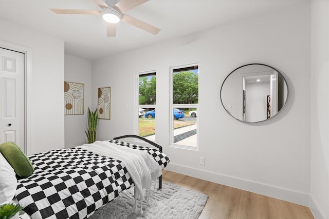 903 Cardiff Dr, Austin, TX 78745 - bedroom featuring light wood finished floors, baseboards, and ceiling fan