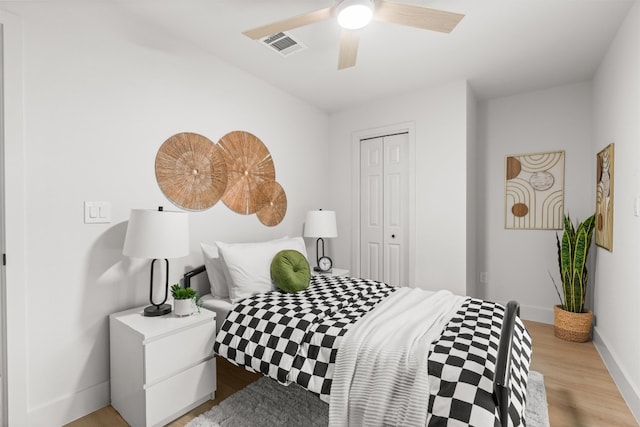903 Cardiff Dr, Austin, TX 78745 - bedroom featuring wood finished floors, a closet, baseboards, and a ceiling fan