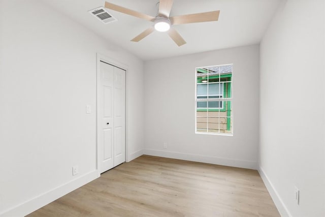 903 Cardiff Dr, Austin, TX 78745 - unfurnished bedroom featuring light wood-style floors, baseboards, a closet, and ceiling fan