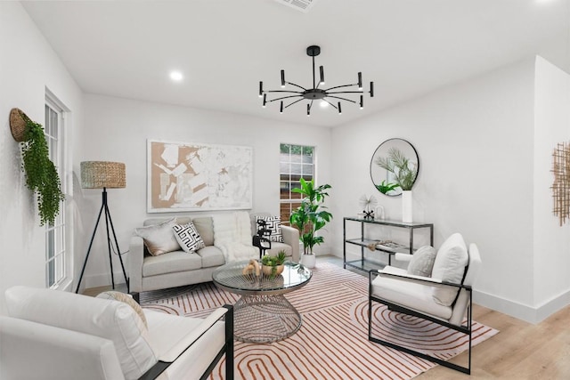 903 Cardiff Dr, Austin, TX 78745 - living area with baseboards, a chandelier, light wood-style flooring, and recessed lighting