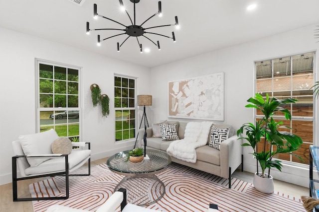903 Cardiff Dr, Austin, TX 78745 - living area featuring a chandelier, baseboards, and wood finished floors