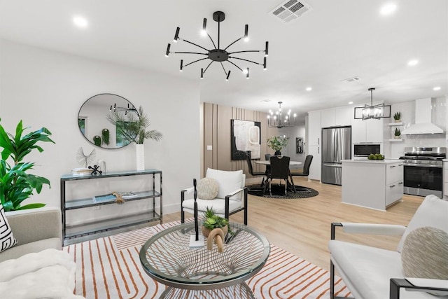 903 Cardiff Dr, Austin, TX 78745 - living area featuring a chandelier, recessed lighting, and light wood-style flooring