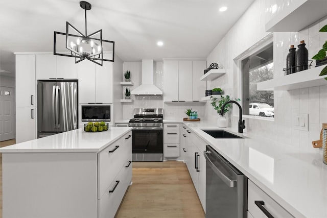 903 Cardiff Dr, Austin, TX 78745 - kitchen featuring open shelves, wall chimney range hood, appliances with stainless steel finishes, a sink, and recessed lighting