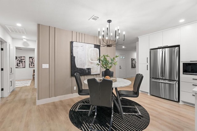 903 Cardiff Dr, Austin, TX 78745 - dining space featuring light wood-style floors, a chandelier, and recessed lighting