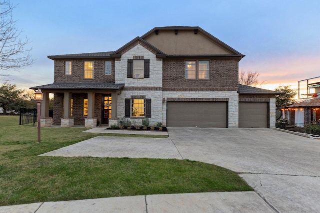103 Bellagio Dr, Lakeway, TX 78734 - view of front facade featuring stone siding, a lawn, concrete driveway, and covered porch