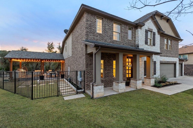 103 Bellagio Dr, Lakeway, TX 78734 - view of front of property featuring a garage, brick siding, concrete driveway, and a gazebo