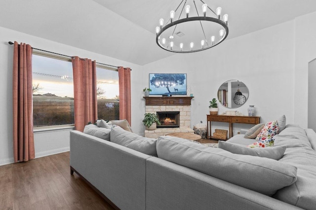 103 Bellagio Dr, Lakeway, TX 78734 - living area with a chandelier, dark wood-style floors, a stone fireplace, baseboards, and high vaulted ceiling