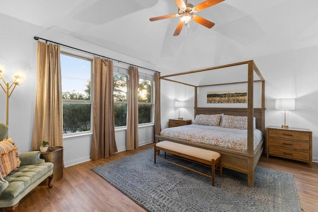 103 Bellagio Dr, Lakeway, TX 78734 - bedroom featuring wood finished floors, lofted ceiling, baseboards, and ceiling fan