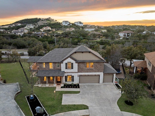103 Bellagio Dr, Lakeway, TX 78734 - view of front of property with a front lawn, an attached garage, concrete driveway, and a porch