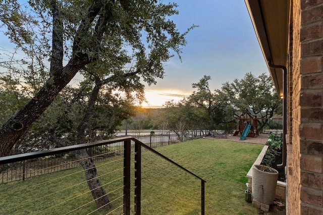 103 Bellagio Dr, Lakeway, TX 78734 - yard at dusk featuring a playground