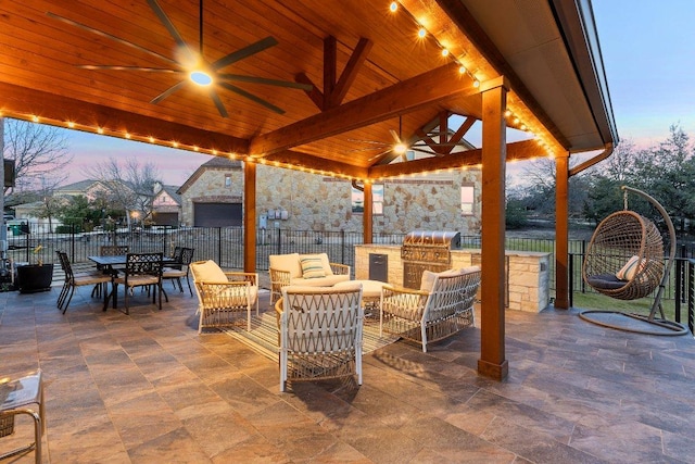 103 Bellagio Dr, Lakeway, TX 78734 - patio terrace at dusk with a gazebo, a ceiling fan, a patio area, outdoor dining space, and an outdoor living space