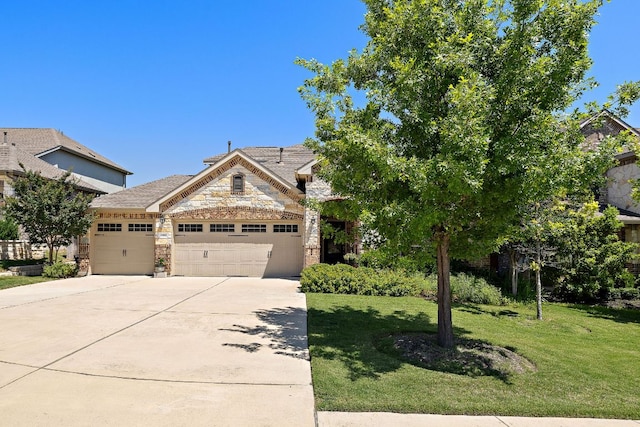 5012 Yucca Bloom Dr, Georgetown, TX 78626 - view of front of home featuring an attached garage, driveway, a front yard, and stone siding