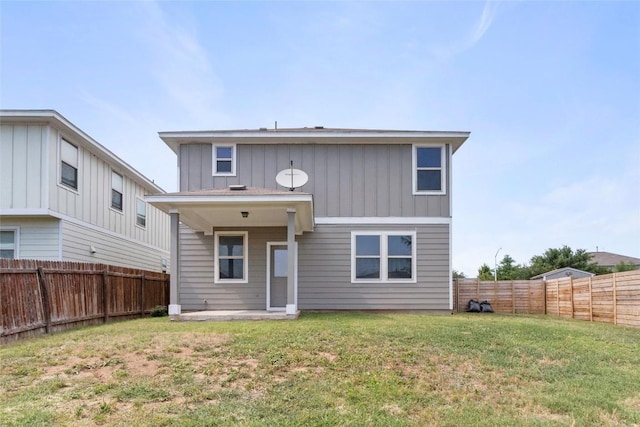 424 Wapiti Rd, Buda, TX 78610 - rear view of house featuring board and batten siding and a patio