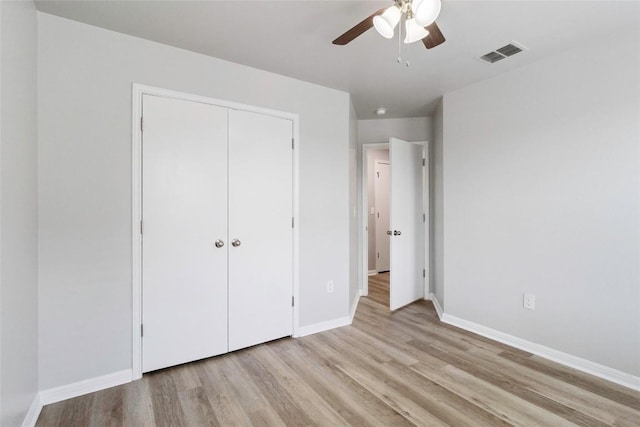 424 Wapiti Rd, Buda, TX 78610 - unfurnished bedroom featuring light wood-style floors, baseboards, a closet, and ceiling fan