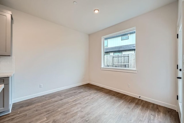 2600 Gattis School Rd Unit 1102, Round Rock, TX 78664 - unfurnished living room featuring wood finished floors and baseboards