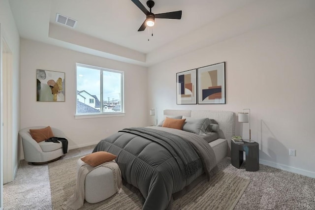 2600 Gattis School Rd Unit 1102, Round Rock, TX 78664 - carpeted bedroom featuring baseboards, a raised ceiling, and a ceiling fan