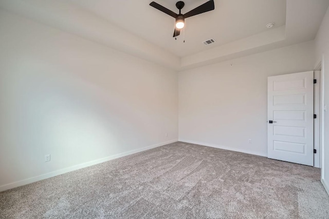 2600 Gattis School Rd Unit 1102, Round Rock, TX 78664 - carpeted empty room featuring a ceiling fan, a tray ceiling, and baseboards