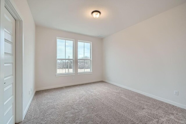 2600 Gattis School Rd Unit 1102, Round Rock, TX 78664 - spare room featuring carpet and baseboards