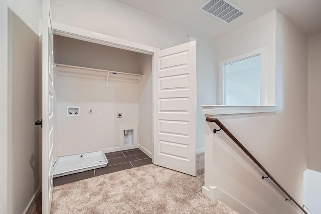 2600 Gattis School Rd Unit 1102, Round Rock, TX 78664 - laundry room with hookup for an electric dryer, washer hookup, hookup for a gas dryer, dark carpet, and baseboards