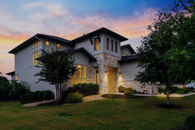 2037 Portobello Rd, Leander, TX 78641 - view of front facade with stone siding, stucco siding, and a front lawn