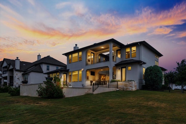 2037 Portobello Rd, Leander, TX 78641 - rear view of property with a balcony, stucco siding, and a chimney