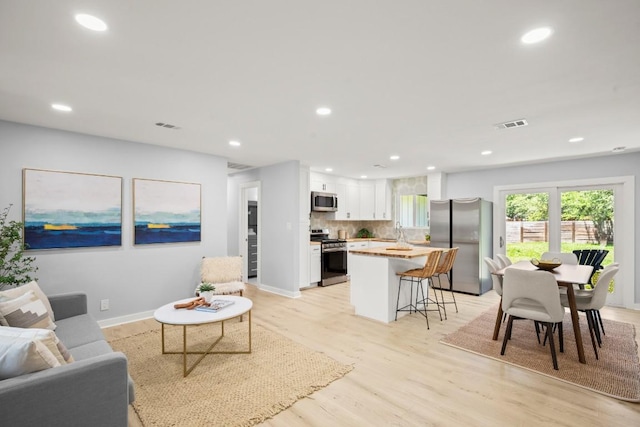 4802 Brighton Rd, Austin, TX 78745 - living area featuring recessed lighting and light wood-style flooring