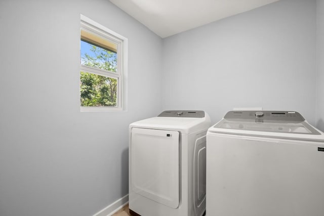 4802 Brighton Rd, Austin, TX 78745 - laundry area with independent washer and dryer and baseboards